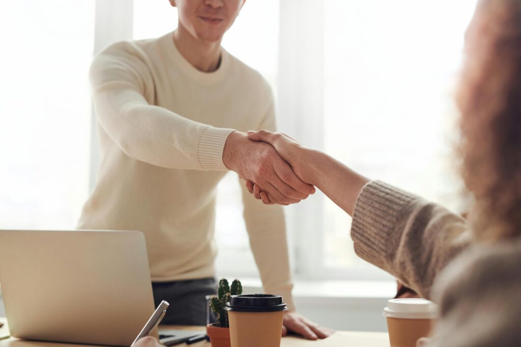 Picture of a hand shake in the beginning of an interview.